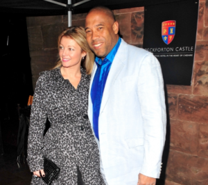 John, pictured with his second wife, has seven children (Credit: FameFlynet)
