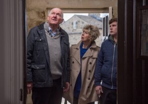 Doug, Diane and Gerry look at the crack in the wall in Emmerdale 