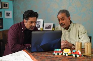 Masood Ahmed and his Uncle Arshad look at a dating site in EastEnders
