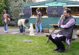 Masood Ahmed waits for a friend in EastEnders