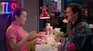 Man gets nail done in salon