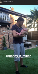 danny miller cuddling Adam Thomas' daughter (Credit: Instagram)
