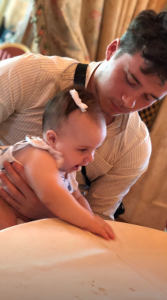 Brooklyn Beckham with his baby cousin