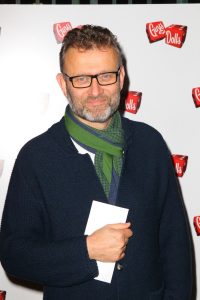 Actor Hugh Dennis wearing a scarf at an event