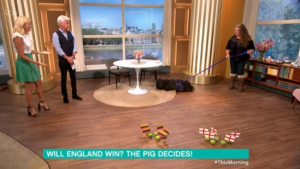 Holly and Phil with Mystic Marcus the psychic pig