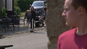 Liv is watched by Lachlan in Emmerdale