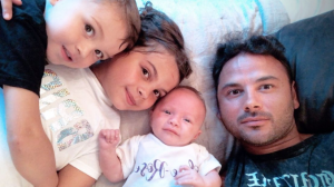 Ryan Thomas with his newphew, daughter and niece