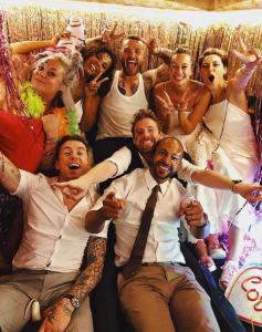 Matt and Emma Willis with guests at wedding vow renewal party