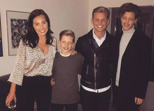 Family smiling at the camera