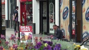 Coronation Street character begging for money on the street