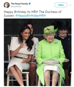 Meghan and Queen sit side by side 
