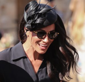 Meghan wears dark glasses as she makes her way to the wedding