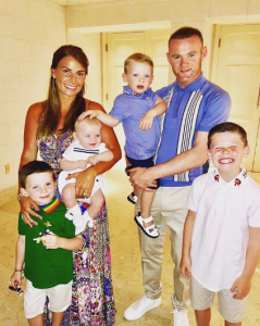 Coleen and Wayne Rooney and their sons