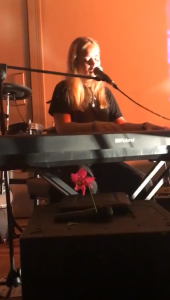 Isobel Steele singing on stage