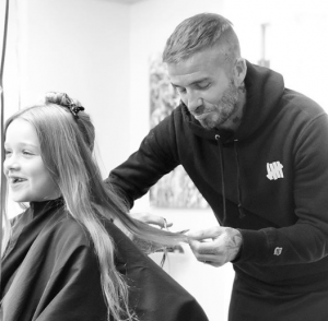 David Beckham trims daughter Harper's hair 