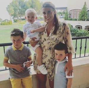 Coleen Rooney poses with sons Kai, Klay and Kit.