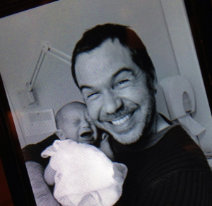 X Factor's first winner Steve Brookstein smiles as he holds his newborn child