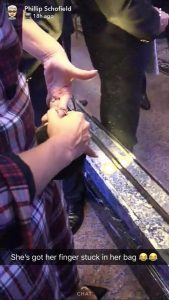 Holly W getting her finger stuck in her bag