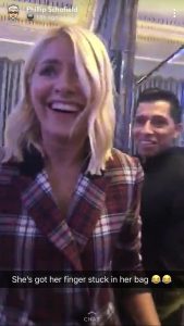 Holly W getting her finger stuck in her bag