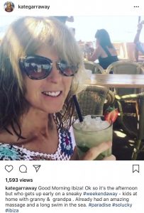 Kate Garraway poses with a drink during a weekend away to Ibiza 