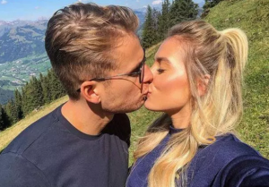 Charlie Brake and Ellie Brown kissing