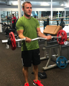 Alan Halsall works out in the gym