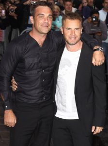 Re-united Take That bandmates Robbie Williams and Gary Barlow arrive at the Radio One studios for an interview on the Chris Moyles show