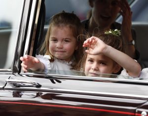 Flower Girls Princess Charlotte (L) and Theodora Williams wave following the wedding of Princess Eugenie of York and Mr. Jack Brooksbank at St. George's Chapel on October 12, 2018 in Windsor, England. (Photo by Alastair Grant - WPA Pool/Getty Images)