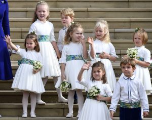 The bridesmaids and page boys, including Prince George and Princess Charlotte, wave as they leave after the royal wedding of Princess Eugenie of York of York and her husband Jack Brooksbank at St George's Chapel in Windsor Castle on October 12, 2018 in Windsor, England. (Photo by Toby Melville - WPA Pool/Getty Images)