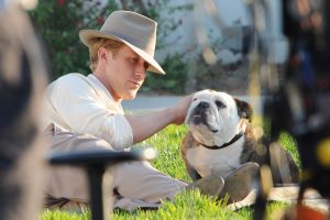 Ryan Gosling with a bulldog on the set of his new movie 'The Gangster Squad'