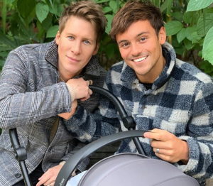 Dustin Lance Black and Tom Daley with their son