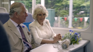 Prince Charles and Camilla onboard a train