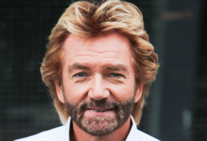 TV presenter Noel Edmonds is pictured leaving the ITV studios with his partner, Elizabeth Davies, following a guest appearance on 'This Morning'.