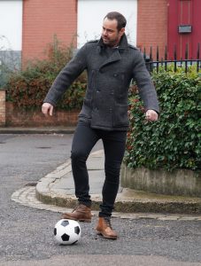 Mick plays football in EastEnders