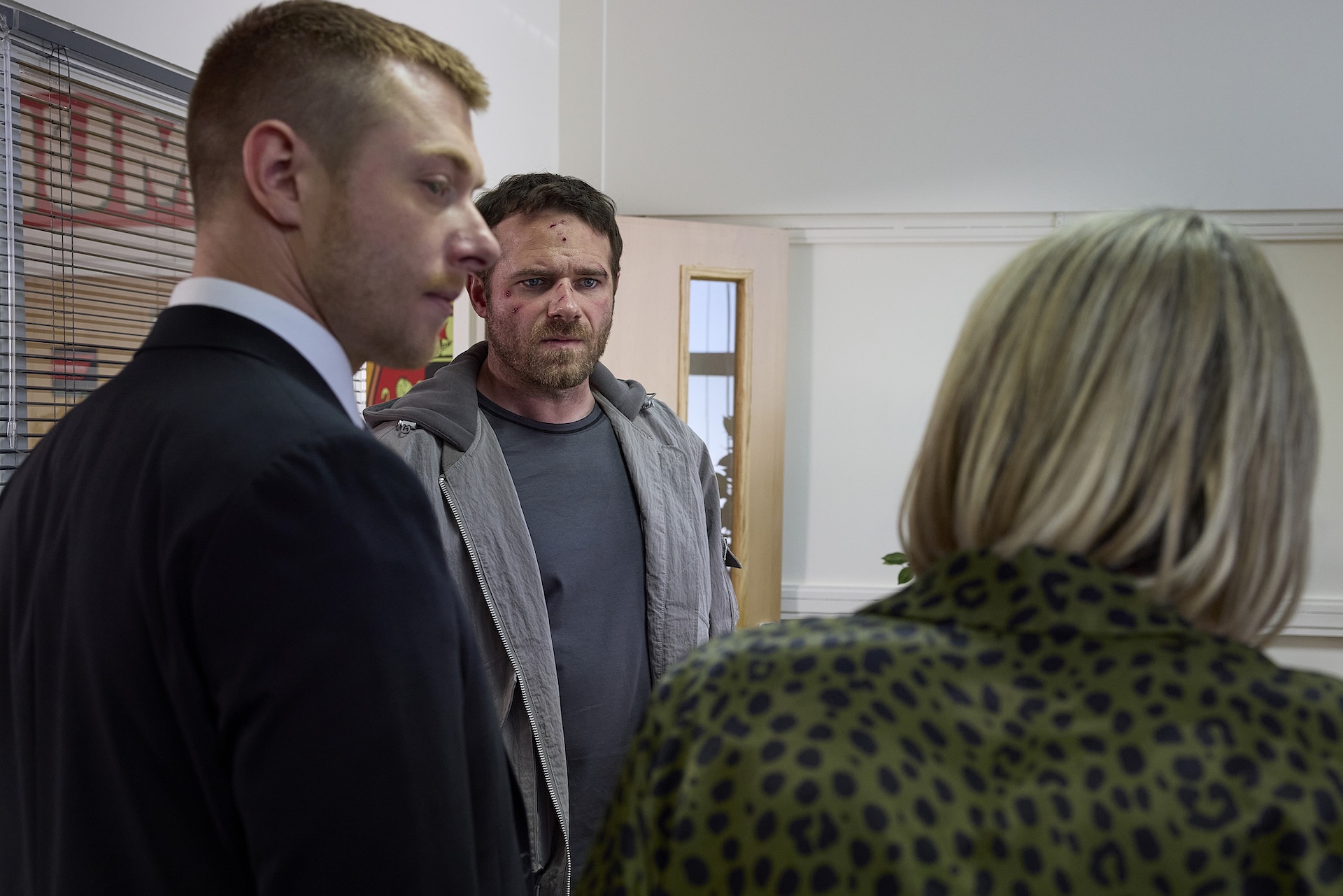Mick, Daniel and Mrs Crawshaw talking at the school