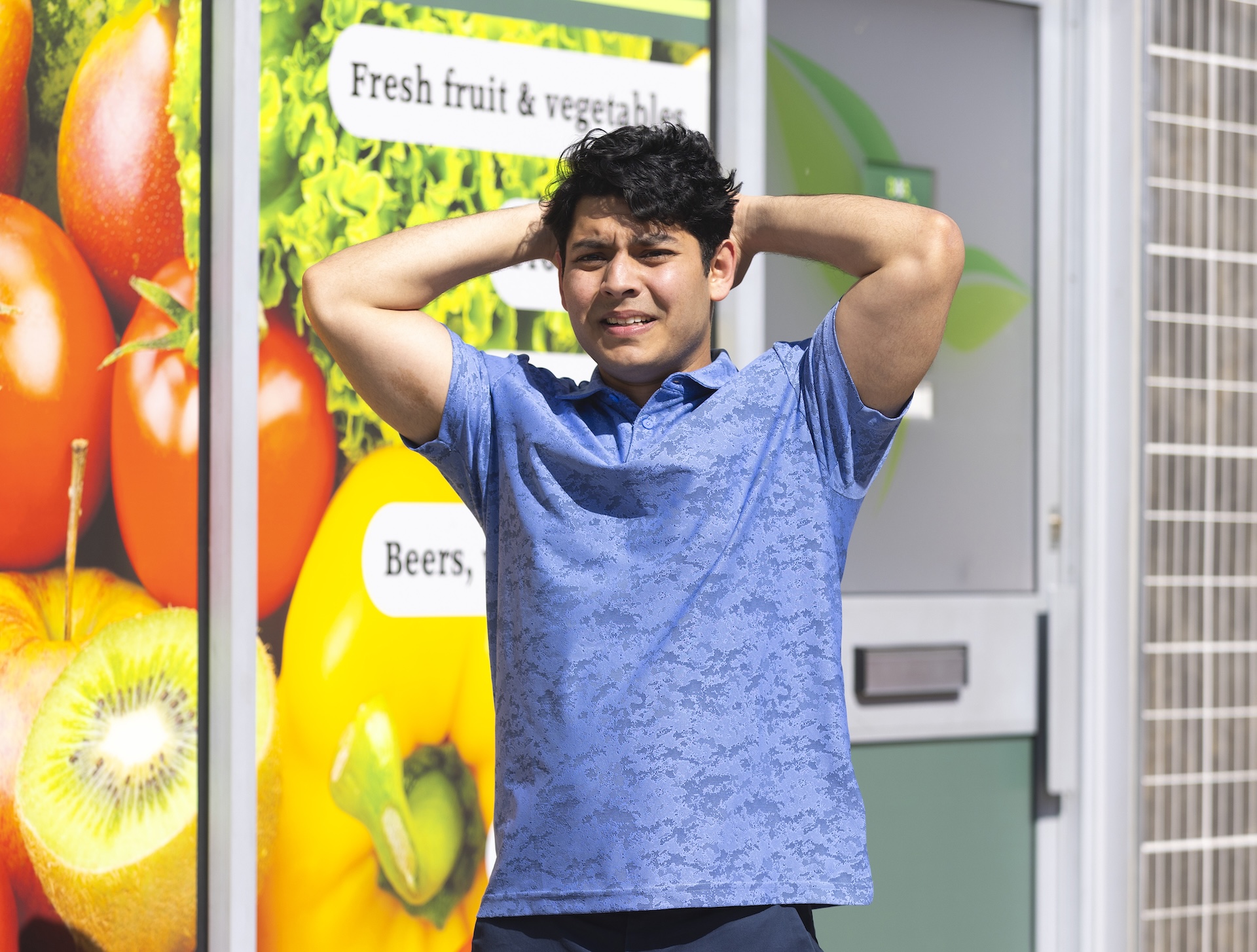 Aadi looks tormented outside the shop on Corrie