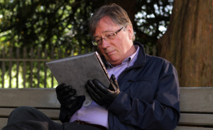 Silas Blissett in Hollyoaks reads a newspaper