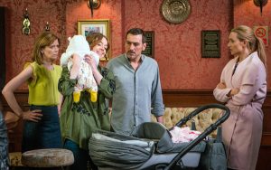 Toyah cuddles baby Susie as Leanne, Peter and Eva watch