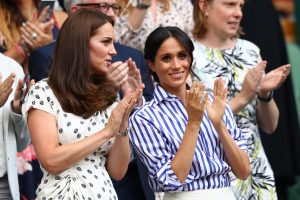 : Catherine, Duchess of Cambridge and Meghan, Duchess of Sussex applaud ahead of the Ladies' Singles final match between Serena Williams of The United States and Angelique Kerber of Germany on day twelve of the Wimbledon Lawn Tennis Championships at All England Lawn Tennis and Croquet Club on July 14, 2018 in London, England. (Photo by Michael Steele/Getty Images)