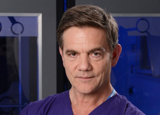 John Michie as Guy Self in Holby City