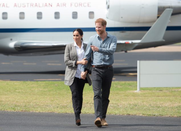 Prince Harry, the Duke of Sussex and Meghan, the Duchess of Sussex arrive at Dubbo Airport