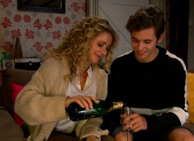 Maya Jacob drinking champagne before they kiss