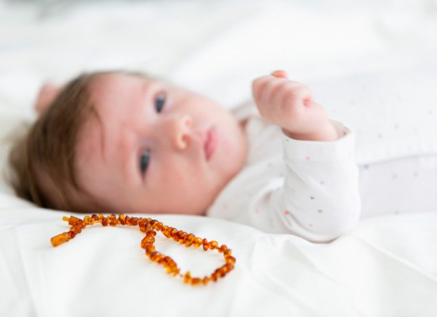 Toddler with teething necklace