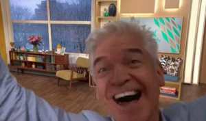 Phil runs around the studio 