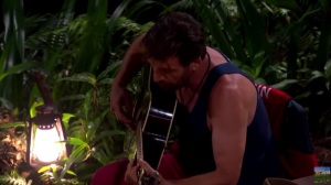 Nick plays guitar in the jungle