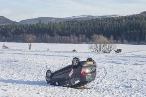 Scottish seasonal snow in Aberdeenshire Caption : Aberdeenshire sees incredible low temperatures as Scotland is hit by a wave of snow and sub zero temperatures. A car is flipped in a field near the town of Crathie. PersonInImage : flipped car Credit : Euan Cherry/WEN