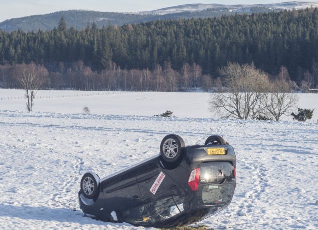 Scottish seasonal snow in Aberdeenshire Caption : Aberdeenshire sees incredible low temperatures as Scotland is hit by a wave of snow and sub zero temperatures. A car is flipped in a field near the town of Crathie. PersonInImage : flipped car Credit : Euan Cherry/WEN
