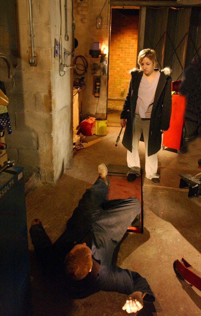 Editorial use only. Exclusive - Premium Rates Apply. Call your Account Manager for pricing. Mandatory Credit: Photo by ITV/REX/Shutterstock (1001301nf) 'Coronation Street' TV - 2005 - Katy Harris (Lucy-Jo Hudson) confronts Tommy Harris (Thomas Craig) . She loses her temper and hits him over the head with a wrench. ITV ARCHIVE