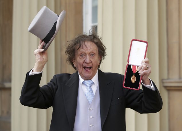 Entertainer Ken Dodd poses for photographers after being made a Knight Bachelor of the British Empire by Britain's Prince William at an investiture at Buckingham Palace in central London