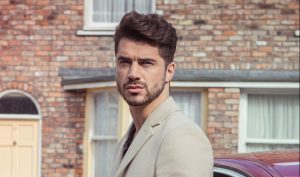 FROM ITV STRICT EMBARGO Tuesday 8 November 2016 Coronation Street - Ep 9035 Wednesday 16 November 2016 A flashy new Jaguar sweeps onto Coronation Street and parks outside Underworld. Adam Barlow [SAM ROBERTSON] steps out Picture contact: david.crook@itv.com on 0161 952 6214 Photographer - Mark Bruce This photograph is (C) ITV Plc and can only be reproduced for editorial purposes directly in connection with the programme or event mentioned above, or ITV plc. Once made available by ITV plc Picture Desk, this photograph can be reproduced once only up until the transmission [TX] date and no reproduction fee will be charged. Any subsequent usage may incur a fee. This photograph must not be manipulated [excluding basic cropping] in a manner which alters the visual appearance of the person photographed deemed detrimental or inappropriate by ITV plc Picture Desk. This photograph must not be syndicated to any other company, publication or website, or permanently archived, without the